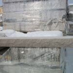 This is a man-made product meant to resemble limestone. It's used for window sills, door thresholds and chimney caps.